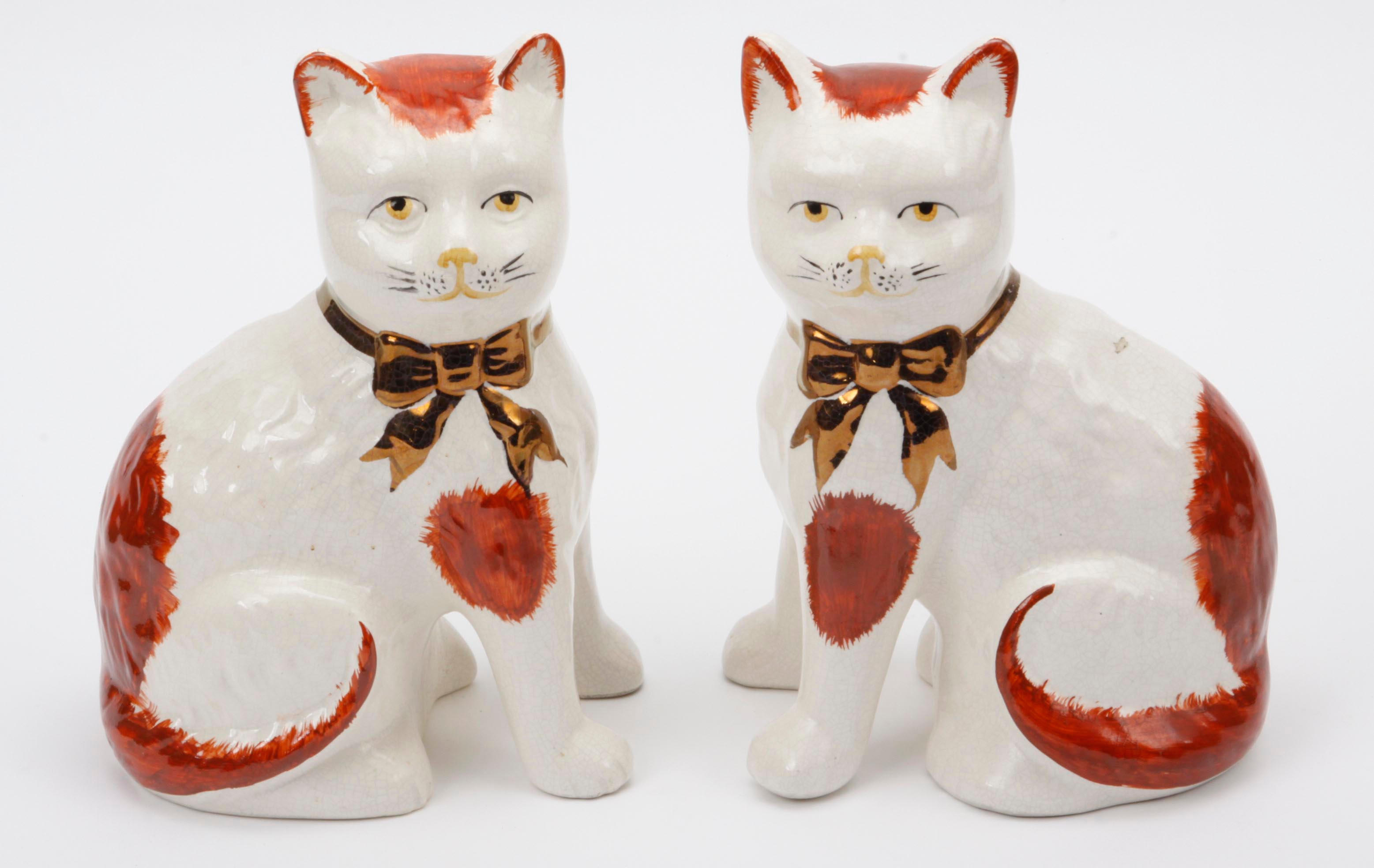 Bonhams : A pair of Staffordshire style figures of cats