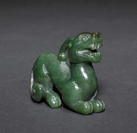 Bonhams A spinach green jade figure of a kylin or other mythological