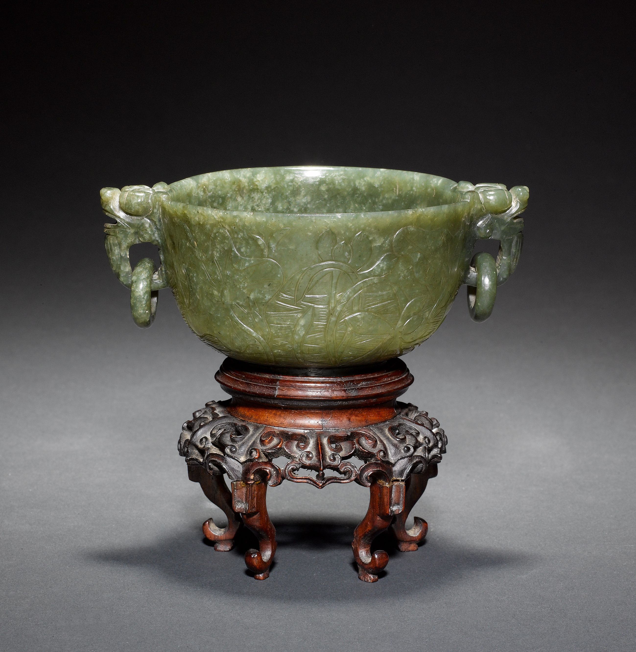 Bonhams A spinachgreen jade bowl with animalhead/loosering handles