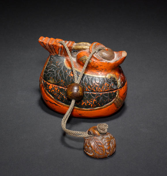 Bonhams : A wood sagemono with attached ojime and netsuke