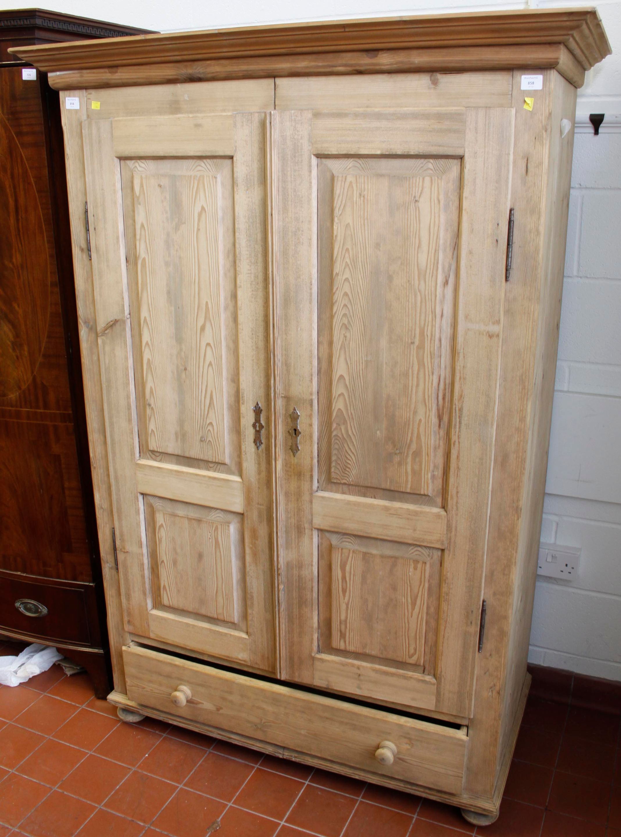A striped pine double wardrobe