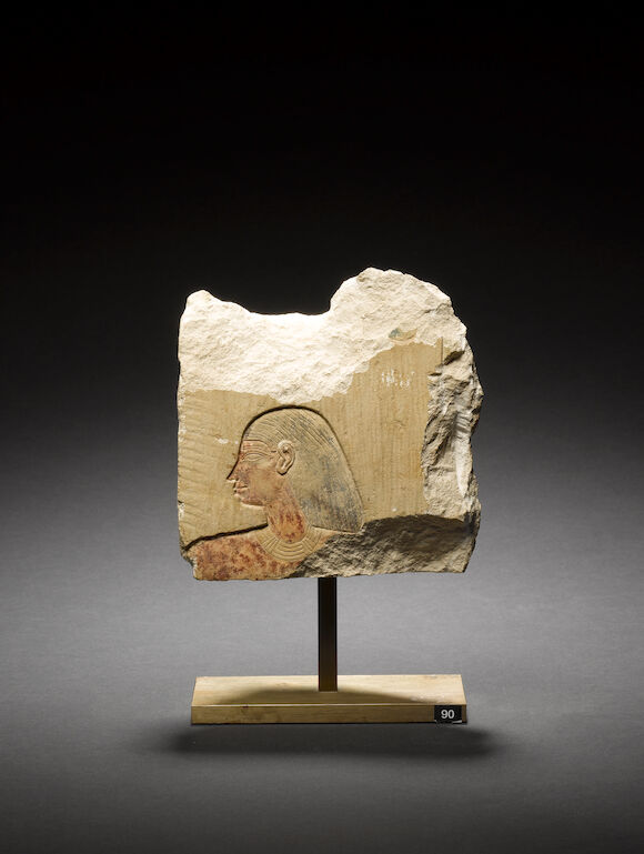 Bonhams : An Egyptian limestone painted relief fragment