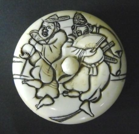 An ivory manju netsuke