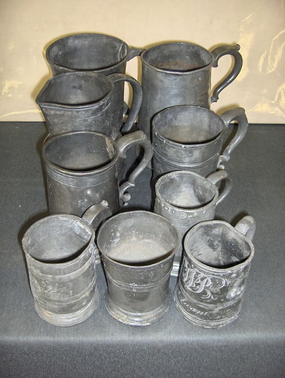 Bonhams A 19th Century pewter baluster jug, two quart mugs and eight