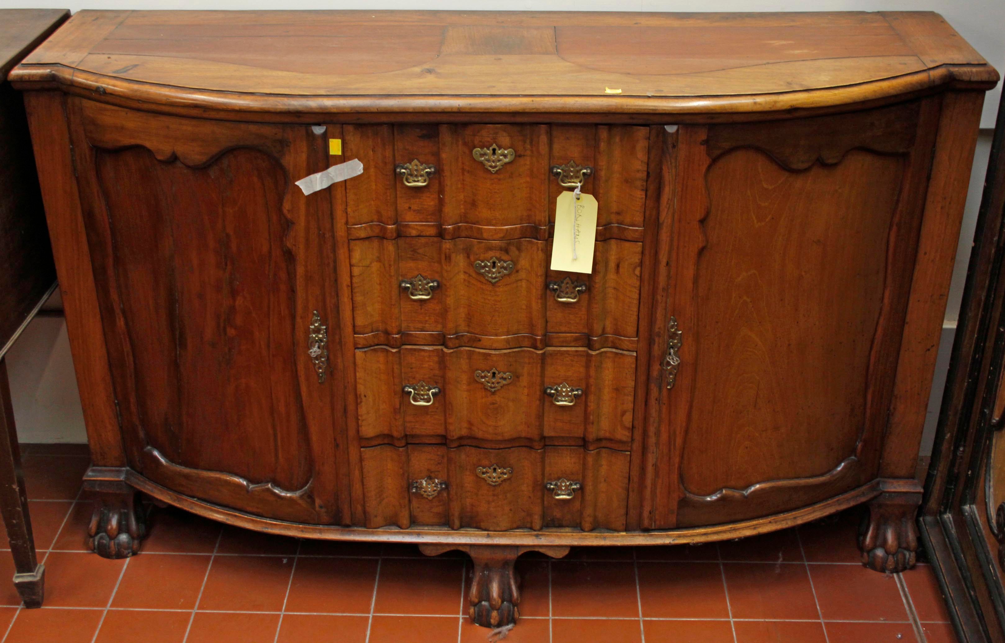 A bow fronted walnut sideboard