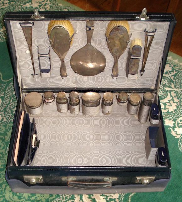 Bonhams A leather cased and silver gentleman's travelling toilet case