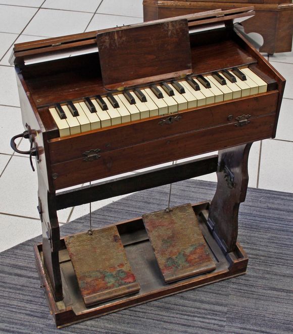 Bonhams A late Victorian 2½ octave portative harmonium,the mahogany