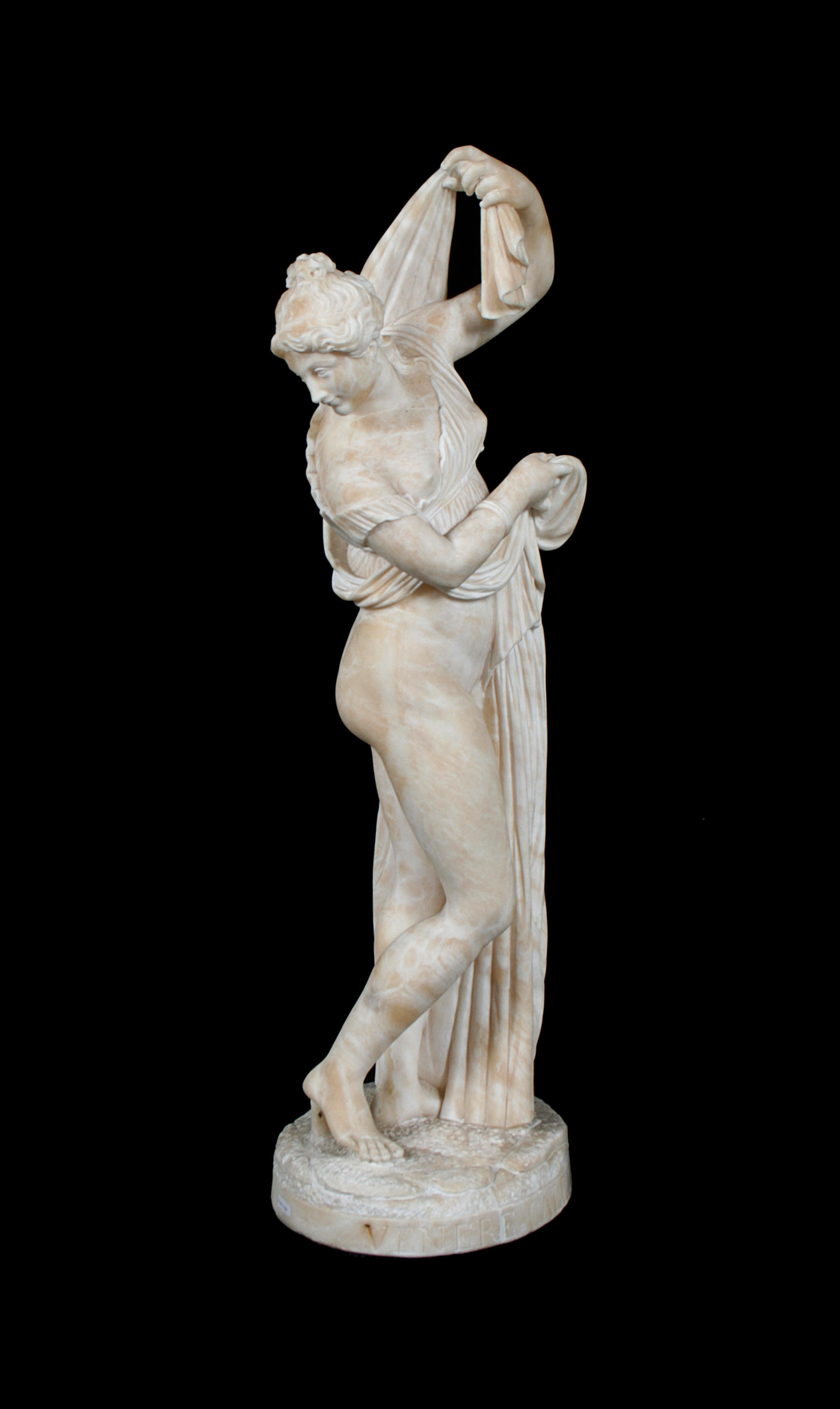 AN ITALIAN MARBLE FIGURE OF THE CALLIPYGIAN VENUS