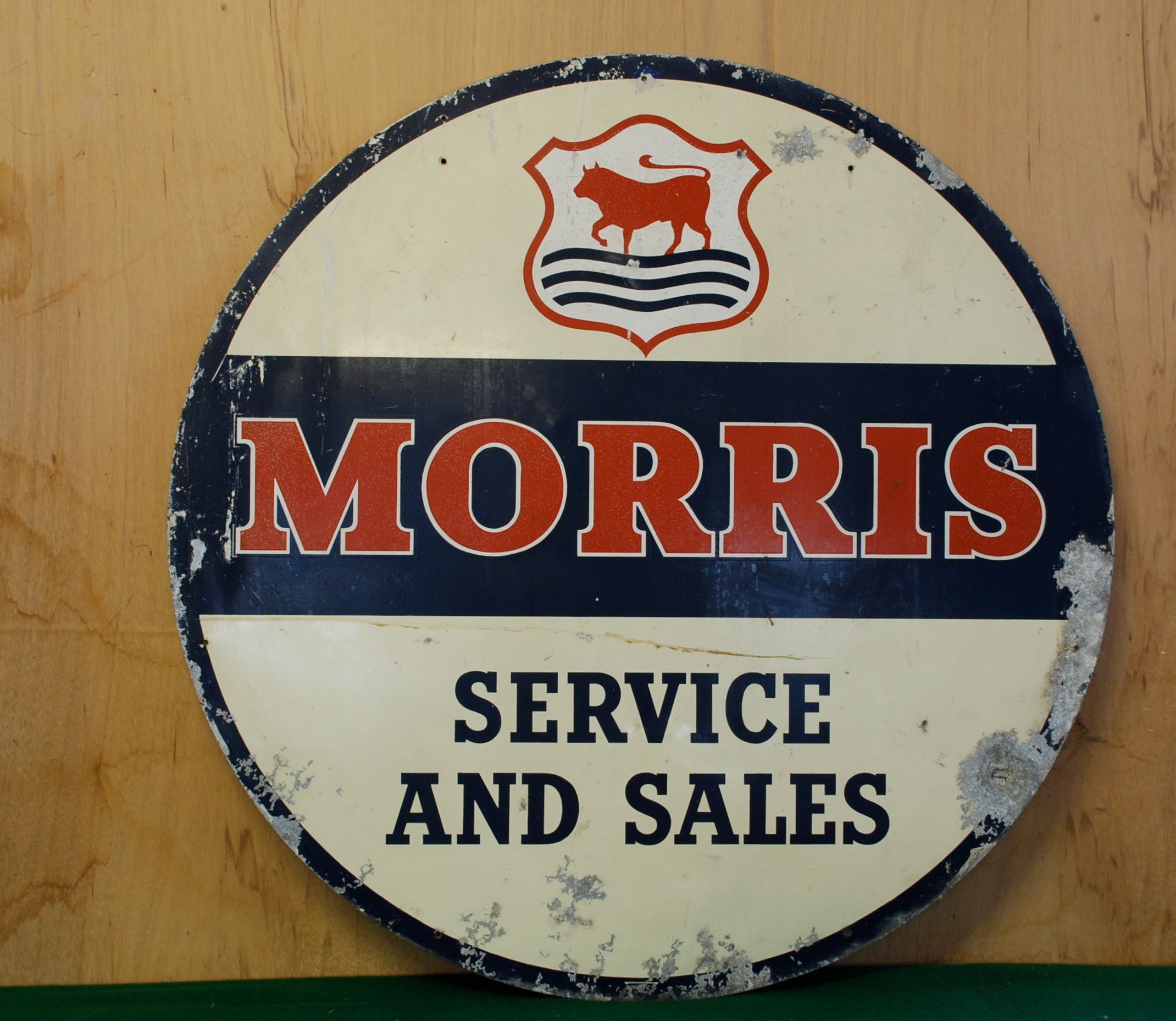 Bonhams Cars A Morris sales and service sign,