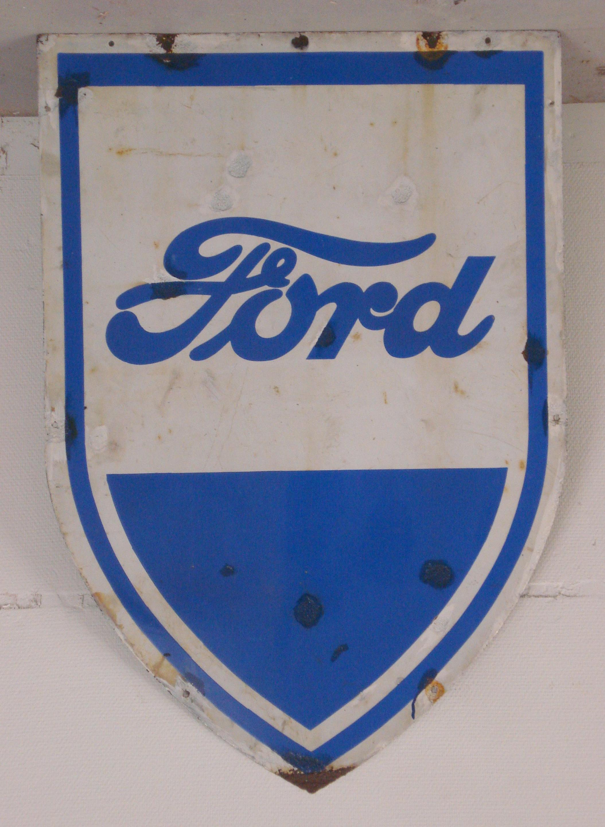 A Ford shield-shaped enamel sign,