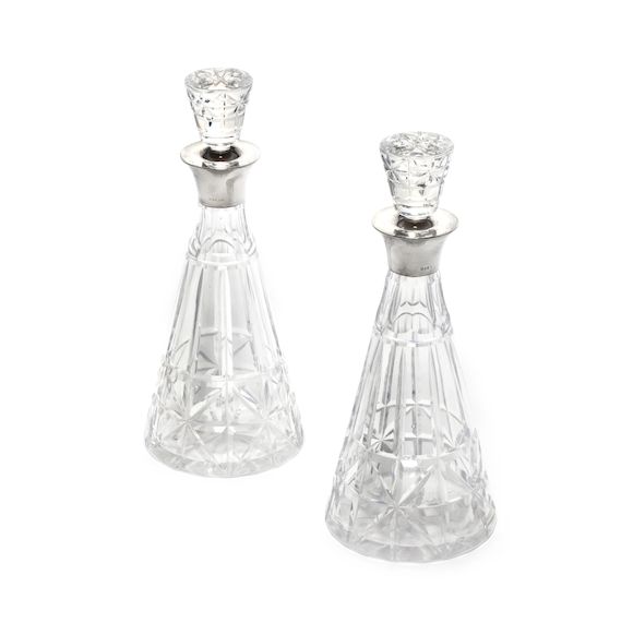 Bonhams A pair of silver mounted glass decanters, maker's mark P & W