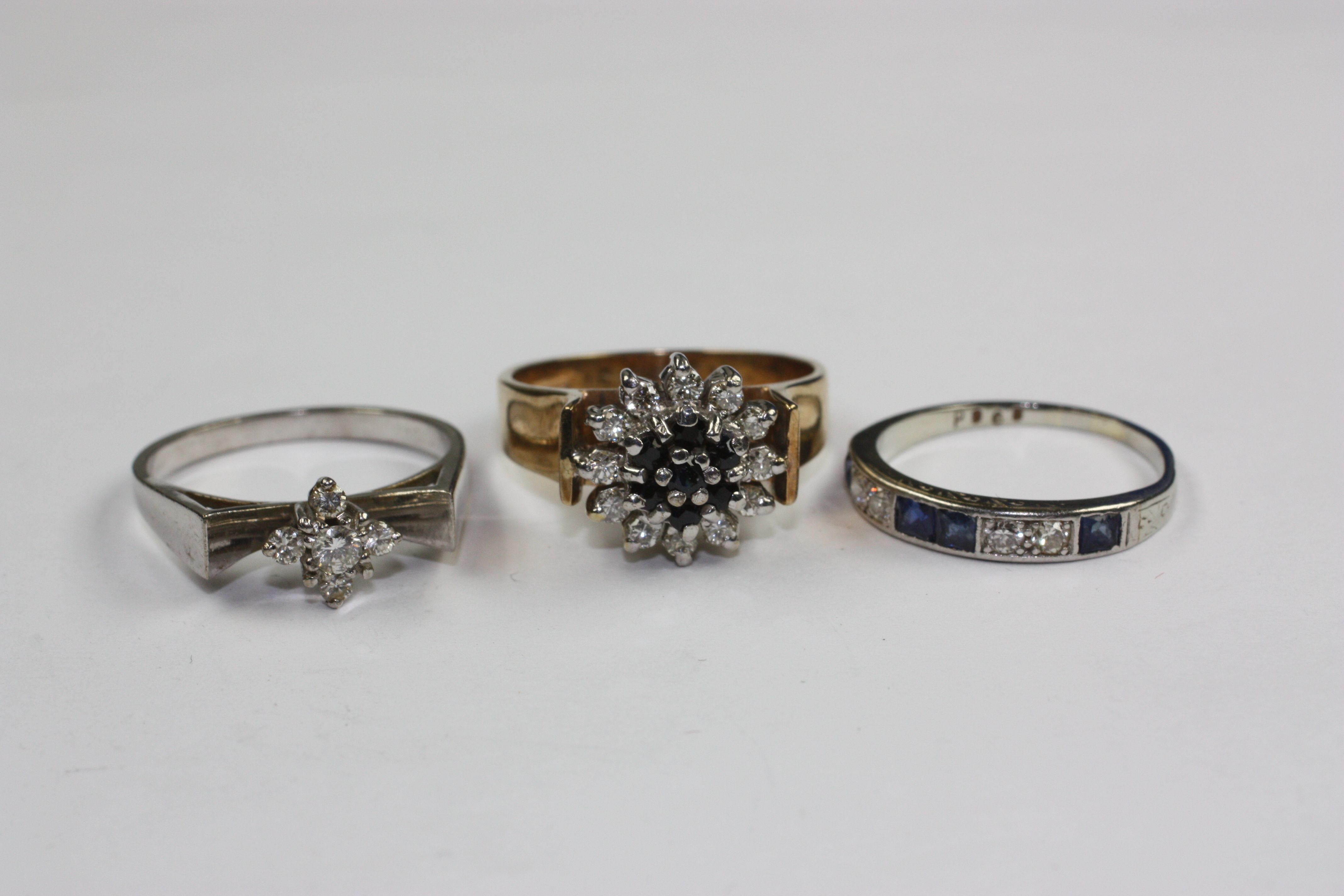 Three gem set rings, (3)