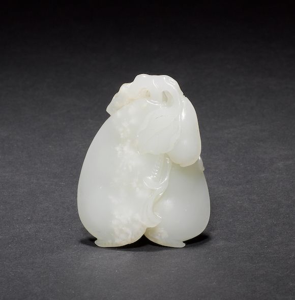 Bonhams A green jade carving designed as a group of gourds or