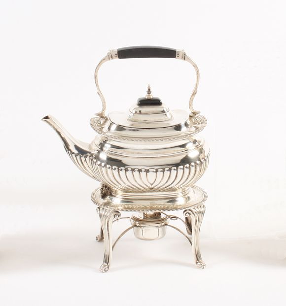 Bonhams A late Victorian tea kettle on stand with burner By William