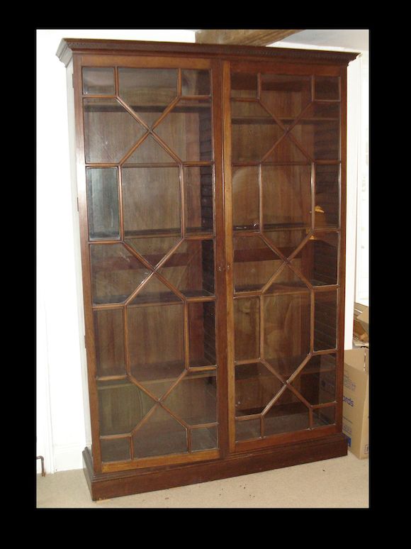 Bonhams A mahogany glass fronted bookcase,