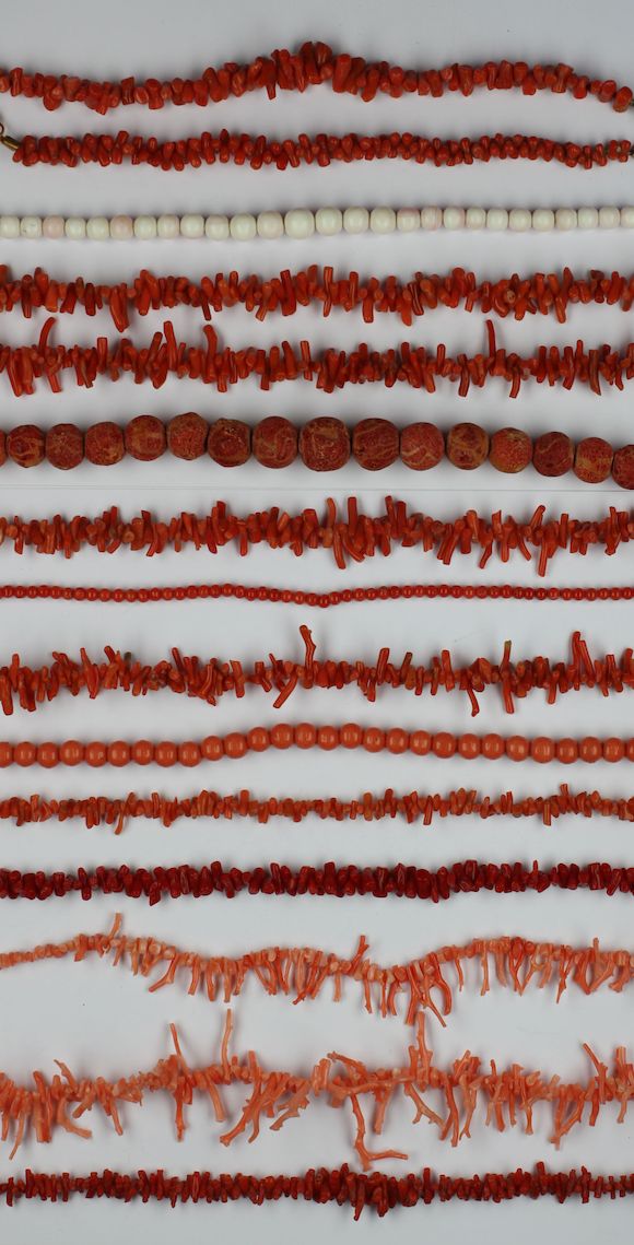 Bonhams : Three strings of coral beads,