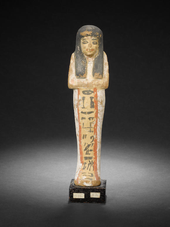 Bonhams : An Egyptian polychrome wood shabti