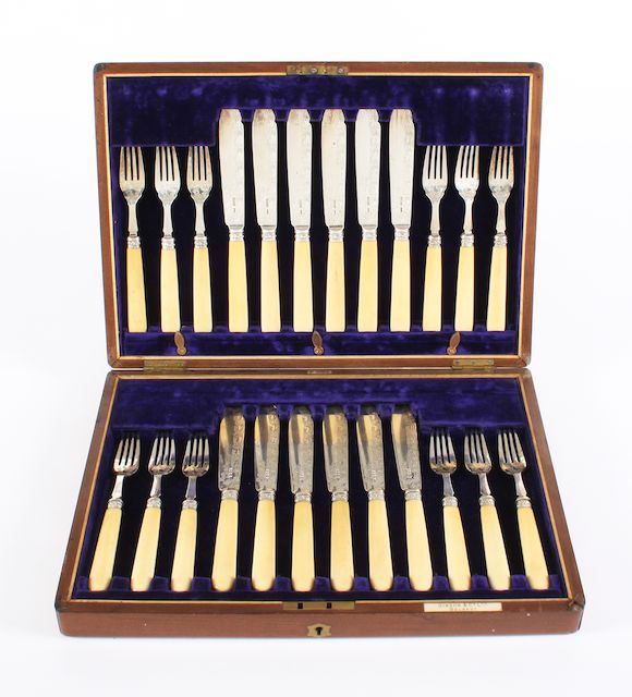 Bonhams A set of twelve pairs of late Victorian silver ivory handled fish knives and forks By