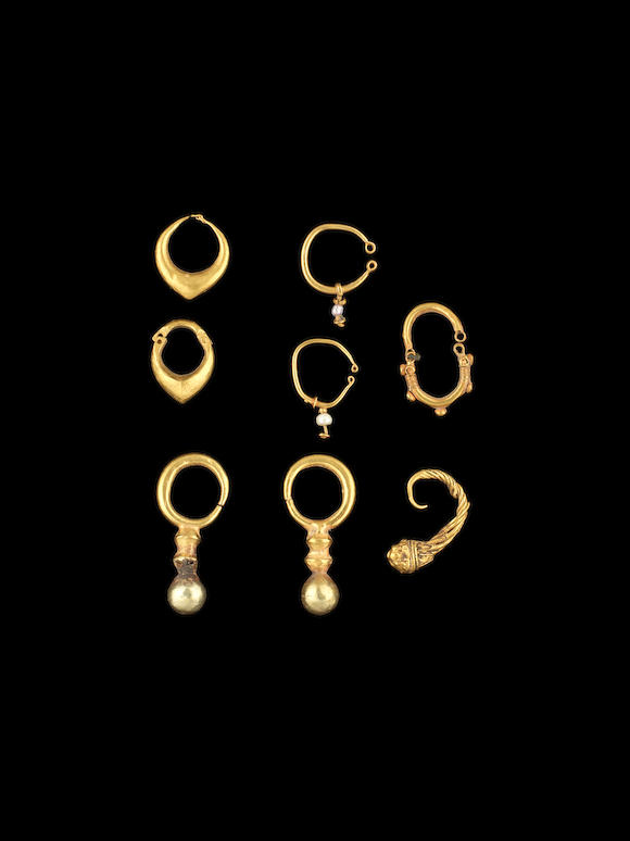 Bonhams : A Hellenistic gold earring and seven Western Asiatic gold ...