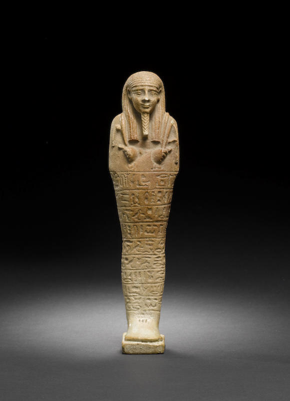 Bonhams : An Egyptian brown glazed composition shabti