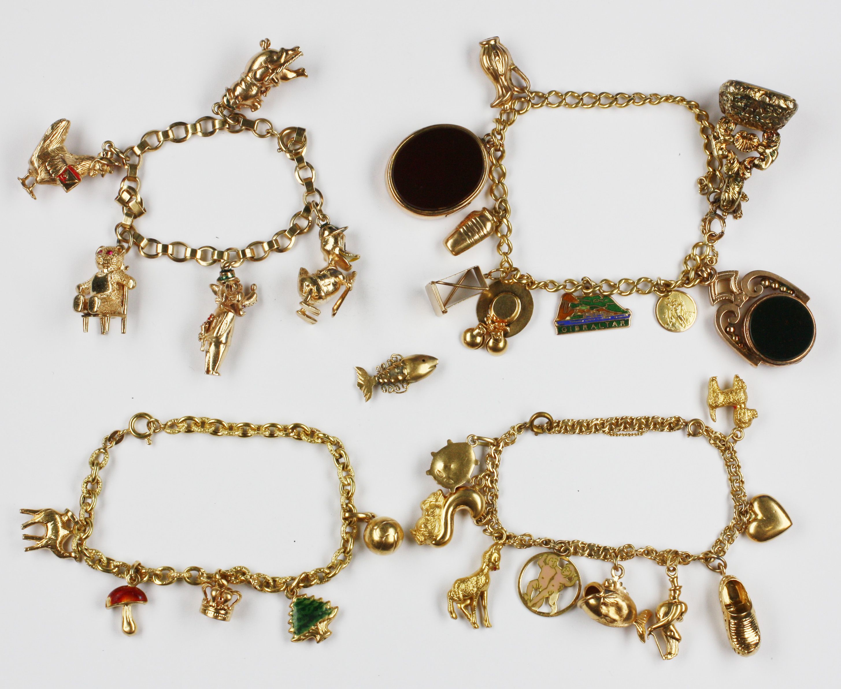 Four charm bracelets