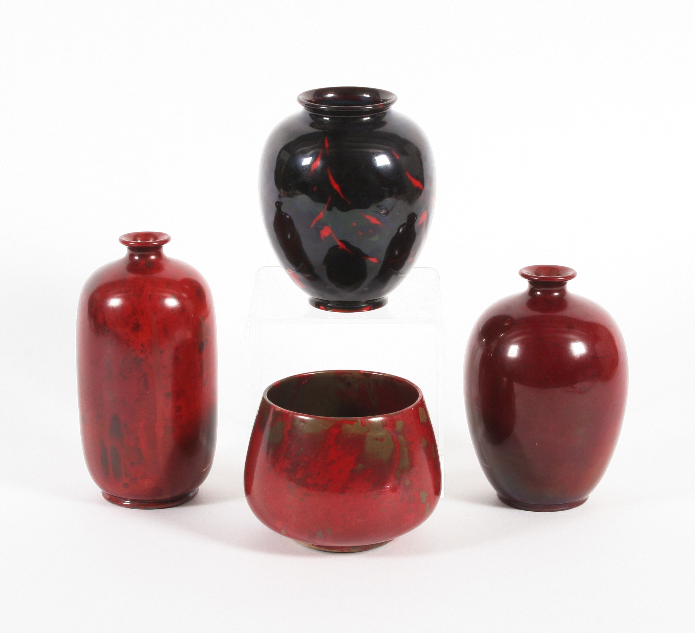 Bonhams A Royal Doulton flambé vase and three Wilkinson's flambé vases