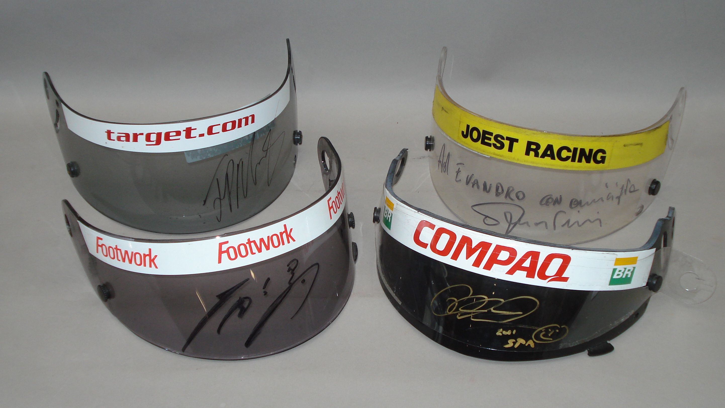 Bonhams Cars : Four driver signed helmet visors,