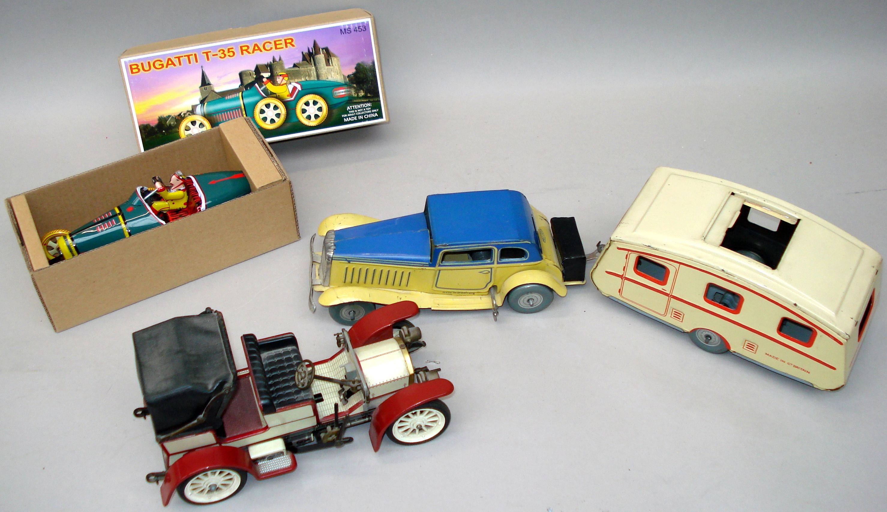 Bonhams Cars Two wind up early tin plate toys,