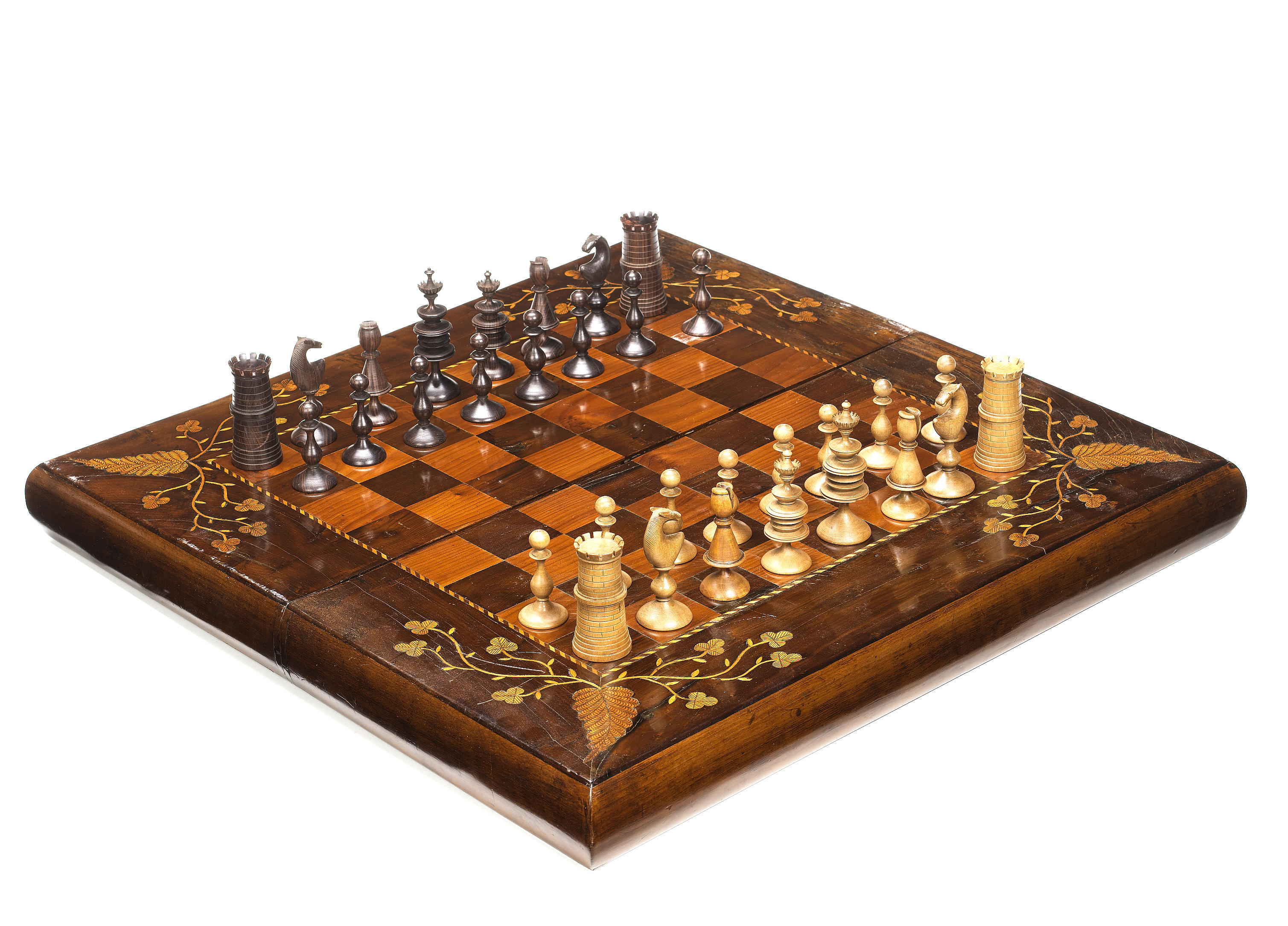 An Irish arbutus wood chess set and board/box,