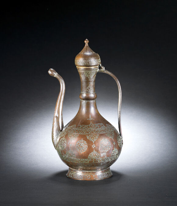 Bonhams : A fine Ottoman engraved tombak Ewer Turkey, 17th Century