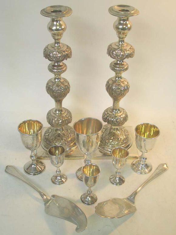 Bonhams A pair of 19th century Polish silver candlesticks, by I A