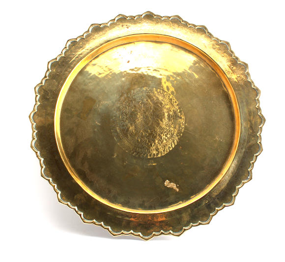 Bonhams : An embossed brass alms dish