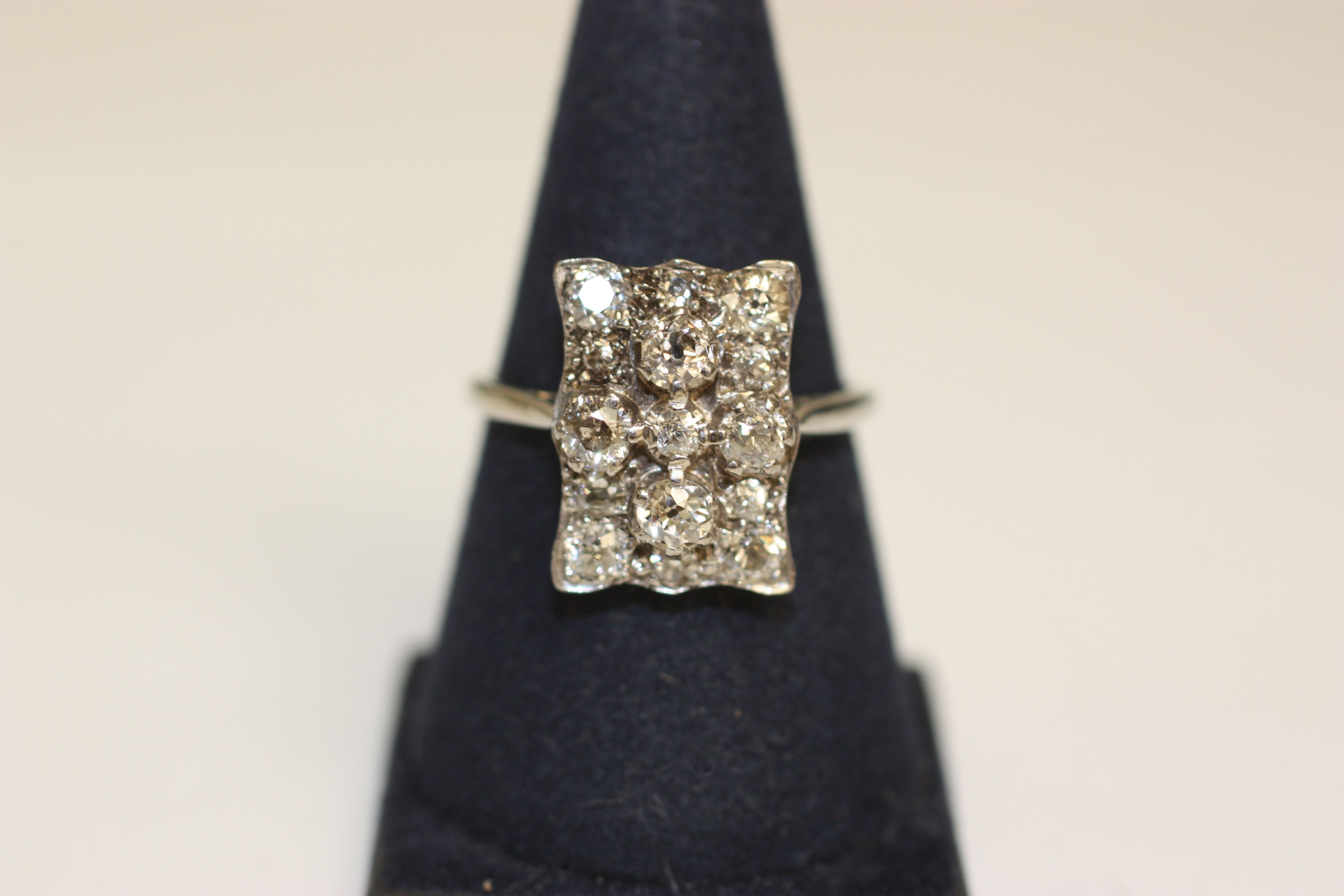 A diamond rectangular panel ring