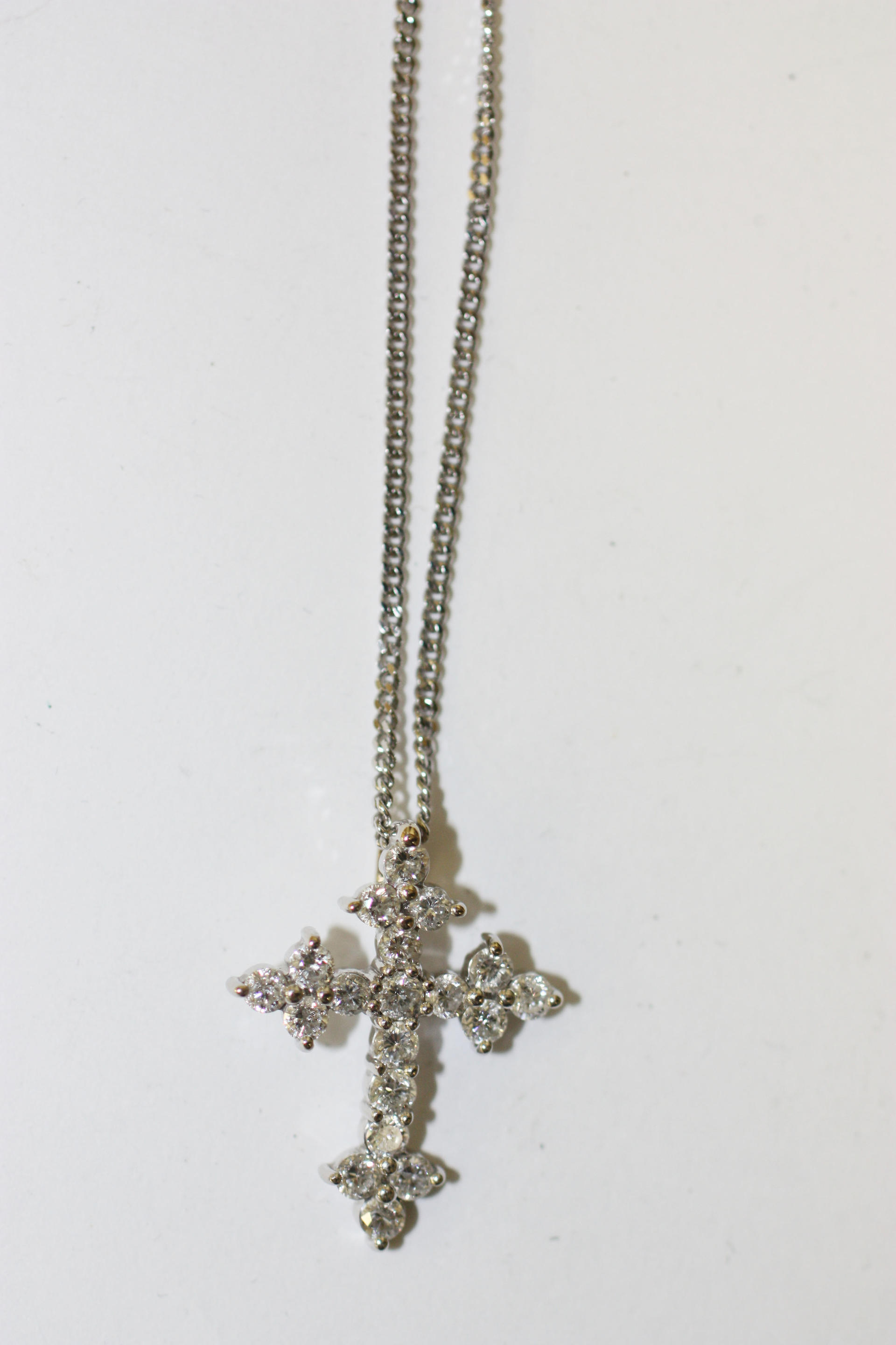 Bonhams : A diamond set cross pendant,