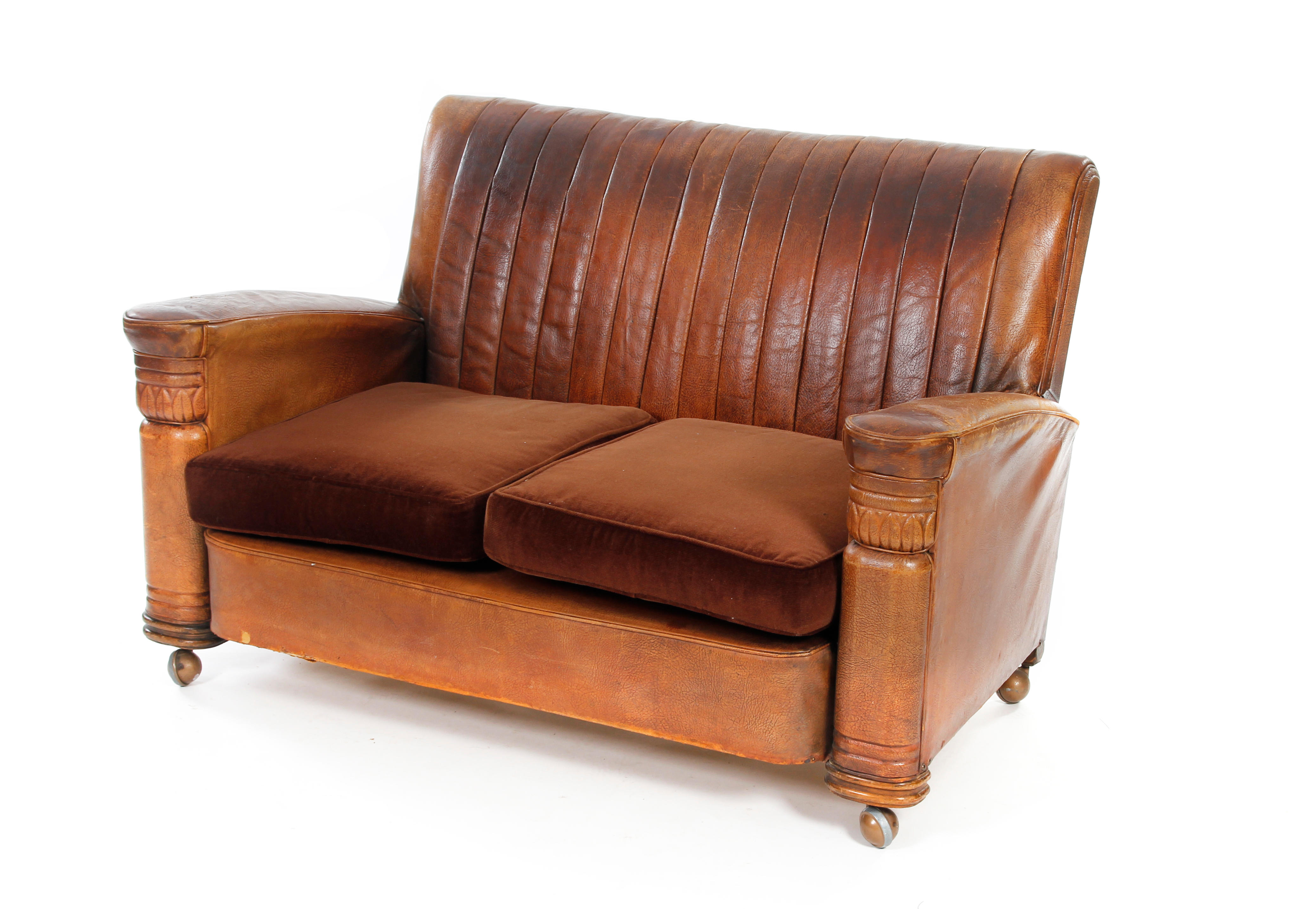 A 1930s Art Deco tan leather-upholstered two-seater settee