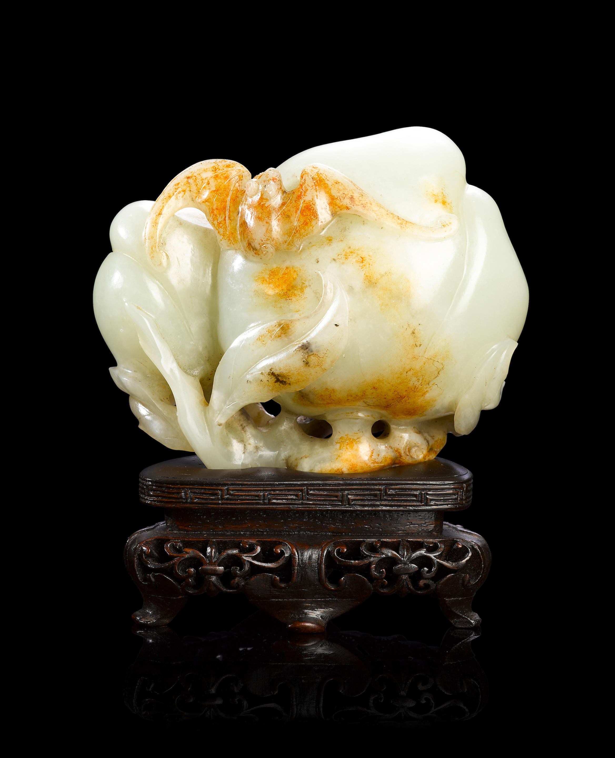 Bonhams : A jade 'peach and bat' carving Mid Qing dynasty