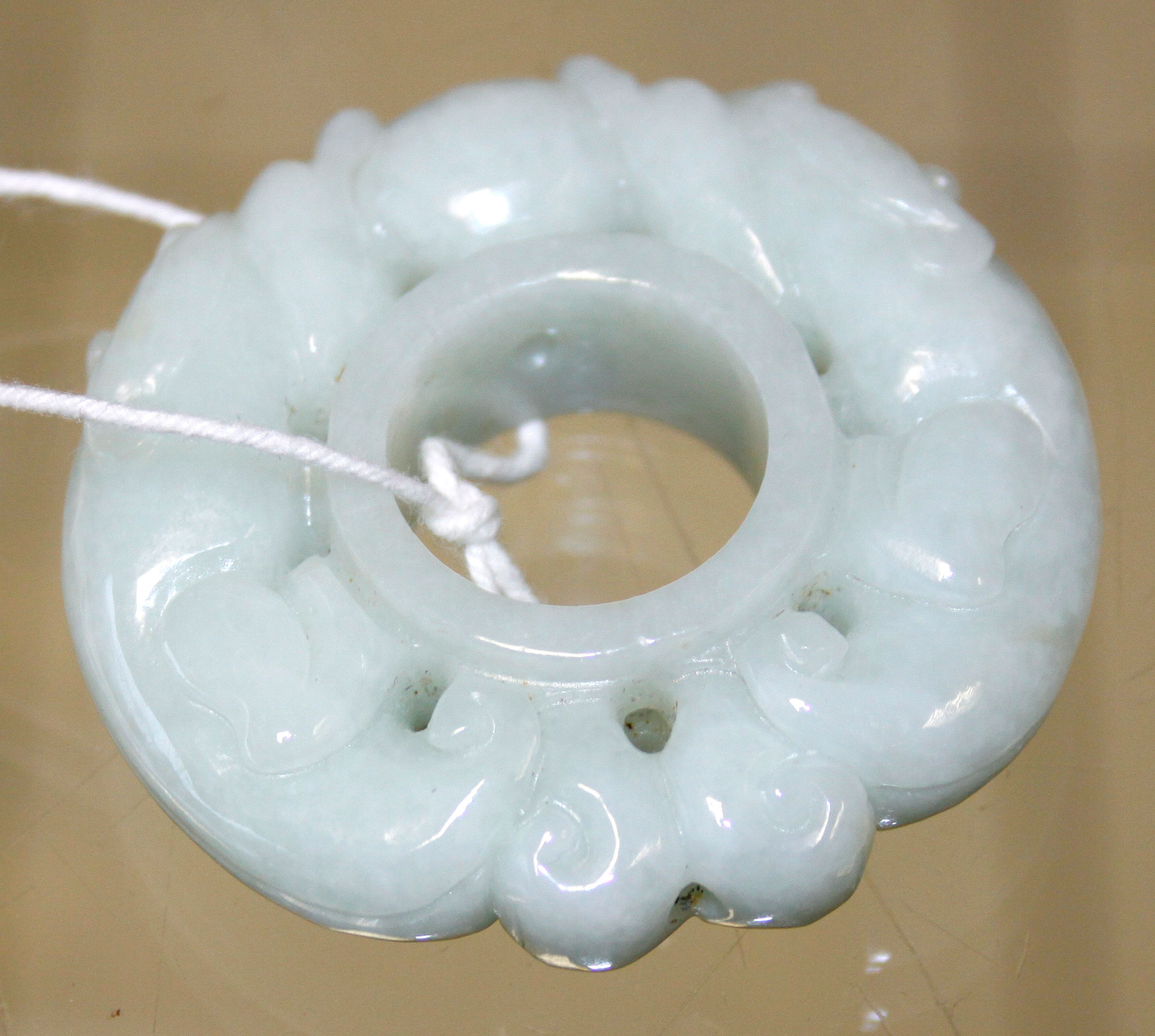 A Jadeite circular pendant