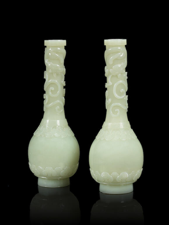 Bonhams A superb and very rare pair of pale green jade vases 18th century