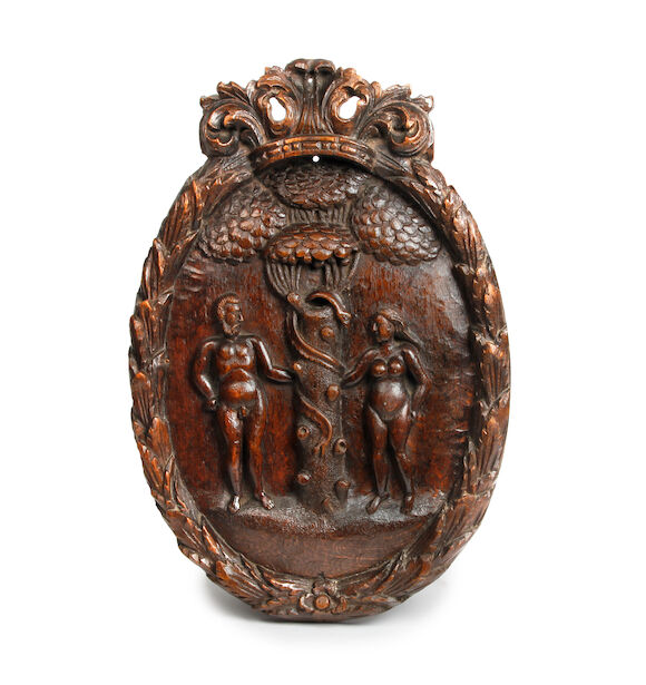 Bonhams : A carved oak oval panel or wall plaque of Adam & Eve in the ...
