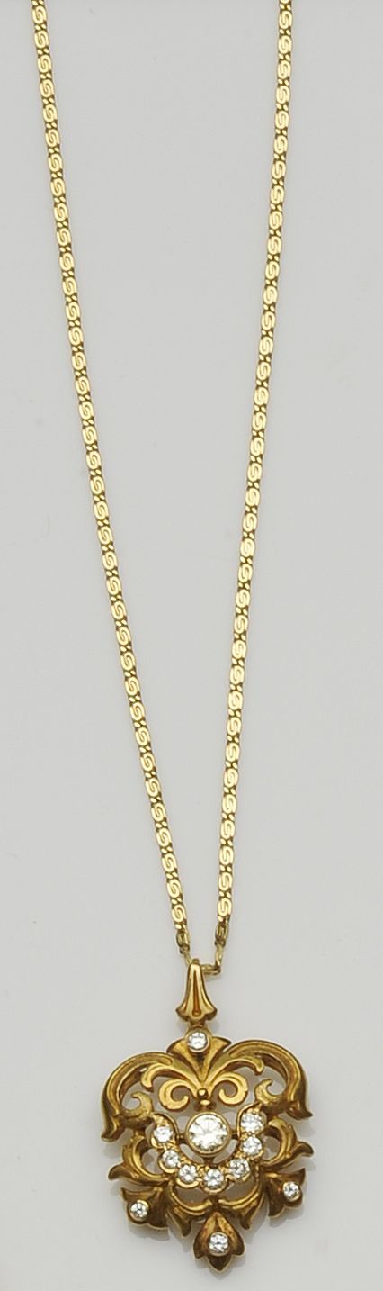 A diamond set scroll pendant