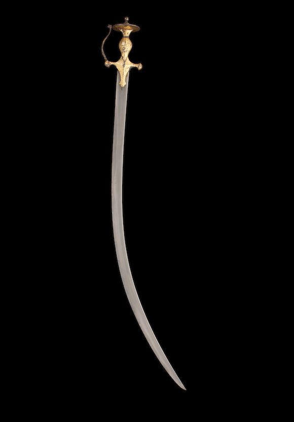Bonhams : A Sikh koftgari-hilted steel Sword (tulwar) India, 19th Century