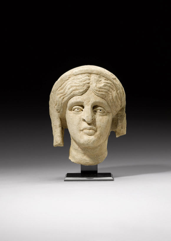 Bonhams : A Roman limestone female head