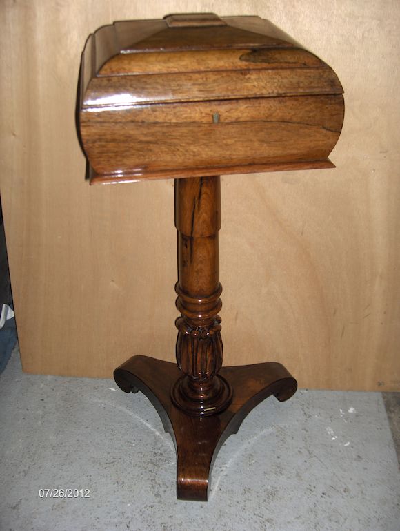Bonhams A Victorian rosewood teapoy converted to a sewing box, raised on a turned column and