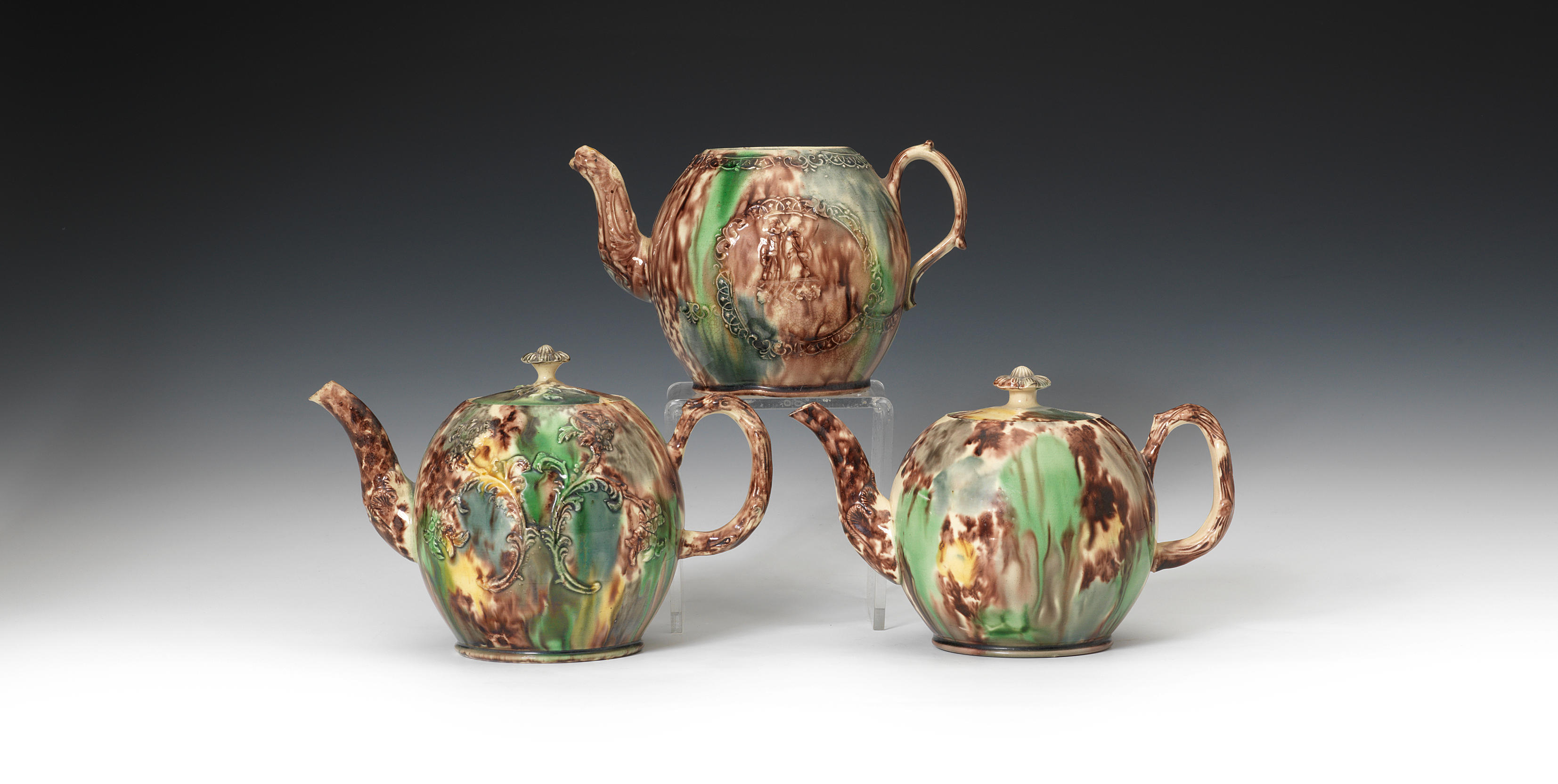 A William Greatbatch teapot and two Staffordshire lead-glazed teapots and...