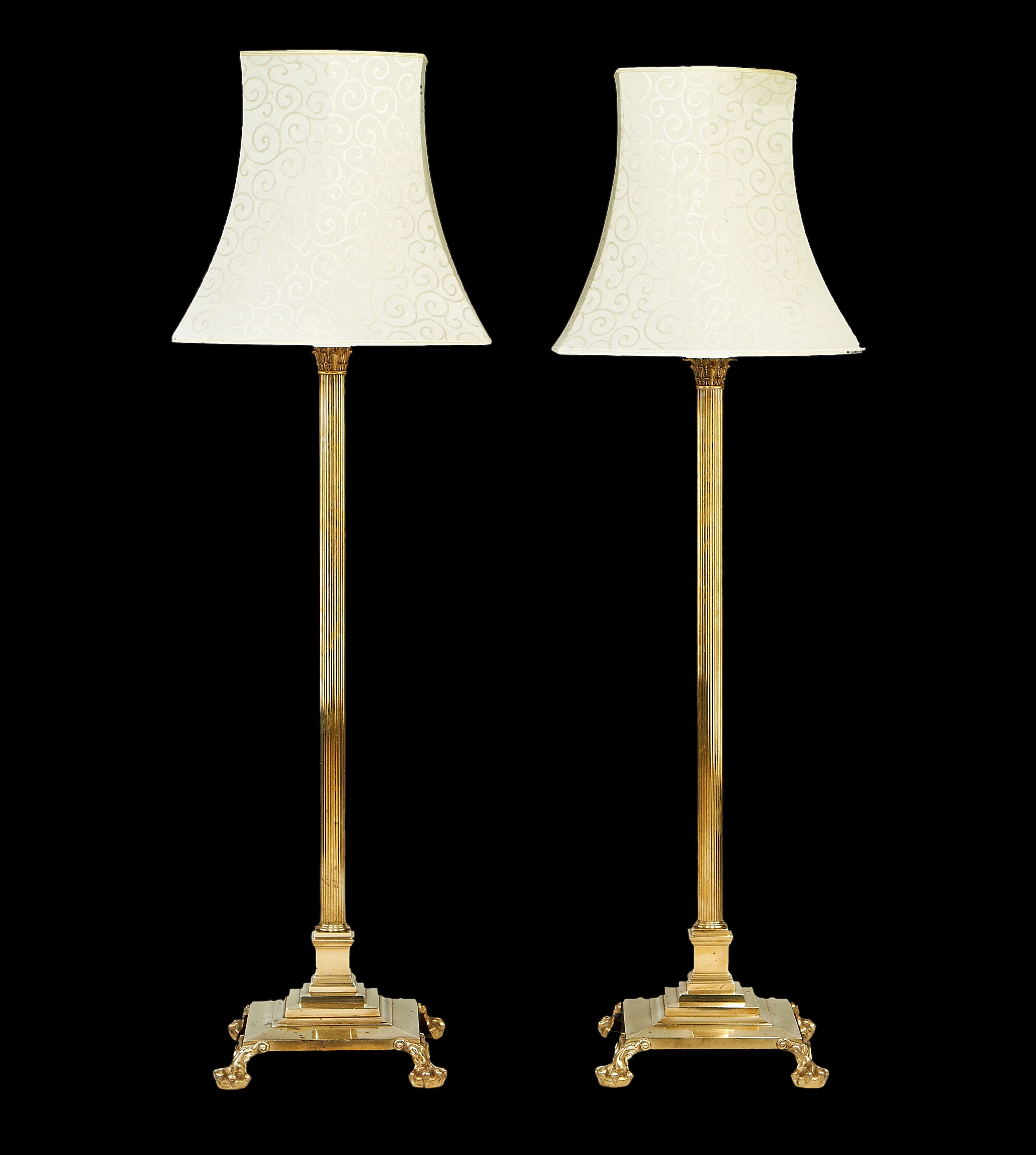 Bonhams A pair of brass standard lamps