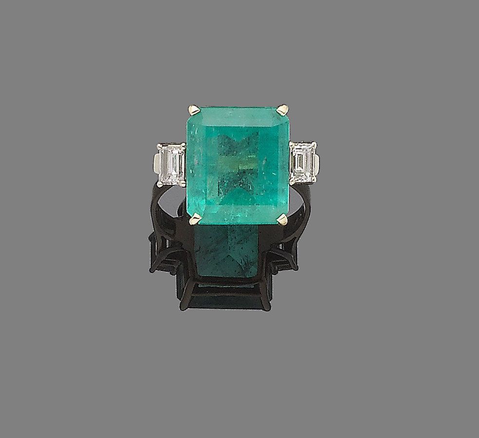 An emerald and diamond ring
