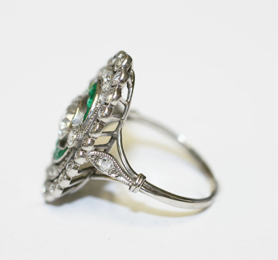 Bonhams : An early 20th century diamond and emerald panel ring