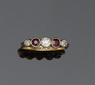 A ruby and diamond five stone ring