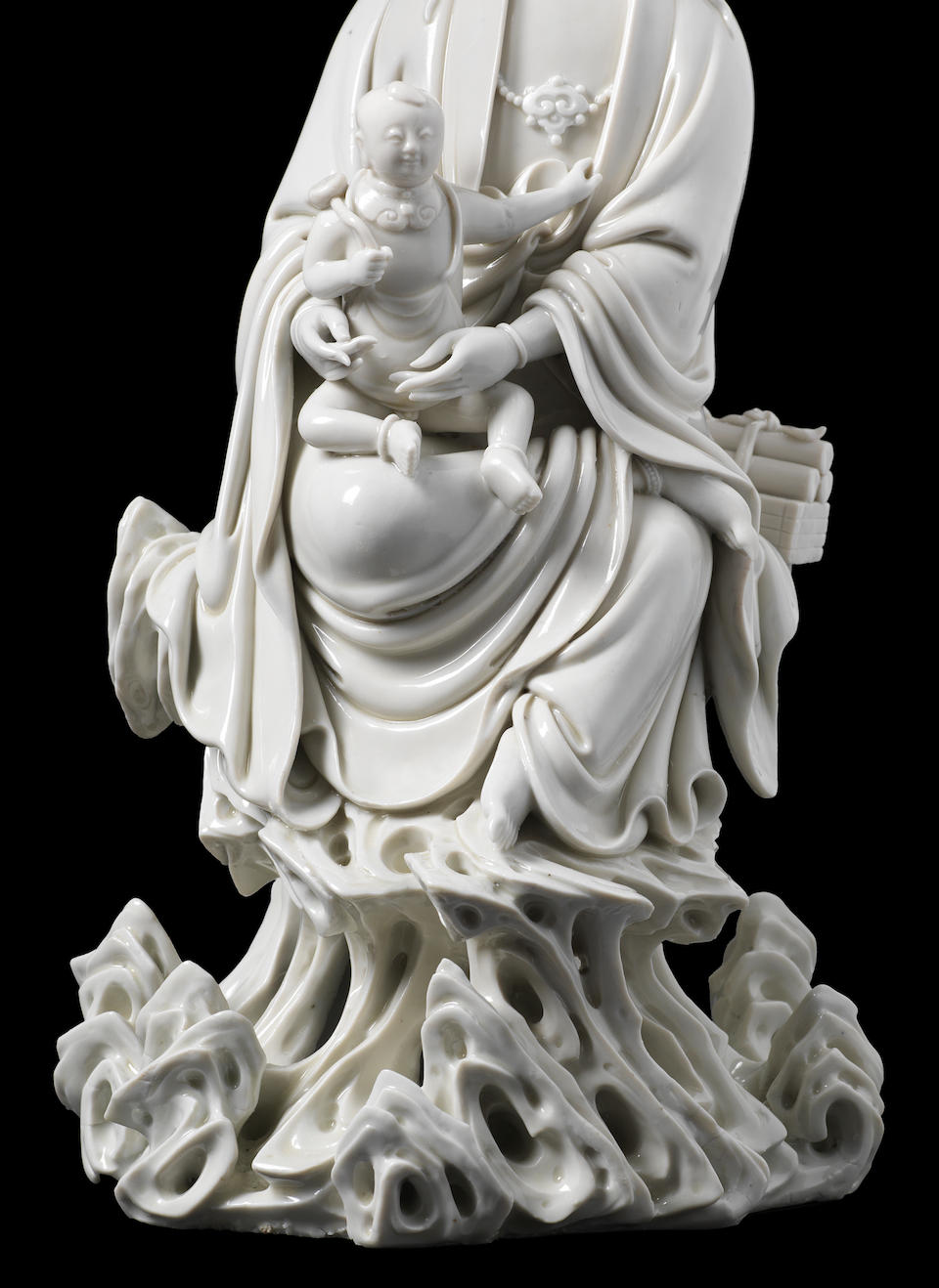 Bonhams : A rare blanc-de-chine figure of Guanyin and child Two ...