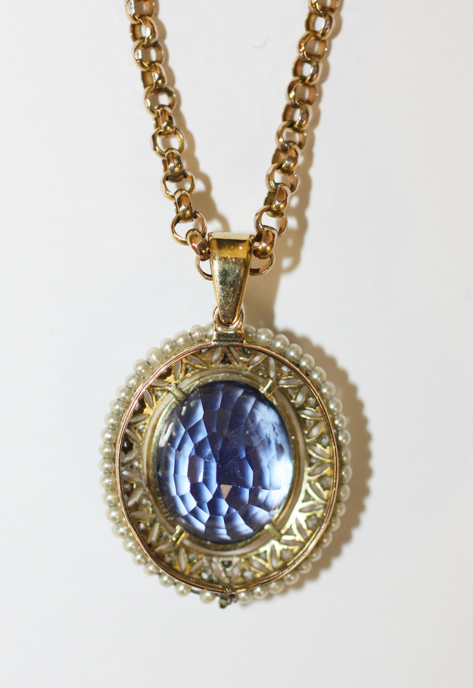 Bonhams : A sapphire, diamond and seed pearl pendant